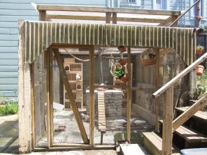 This covered patio was modified to be a 10' x 13' pigeon aviary.