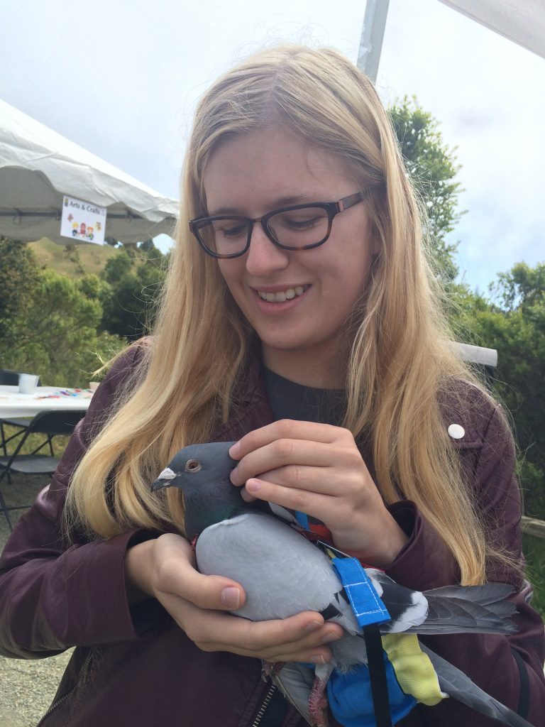 Teenage volunteer with pigeon diplomat