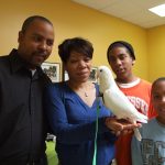 family holding pigeon in pants