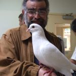 Man holding pigeon