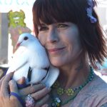 Rescued king pigeon Opal with RocketDog founder Pali