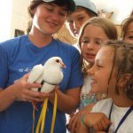 Humane education campers meeting rescued king pigeon