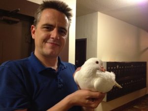 James rescued king pigeon Snow from the streets of San Francisco