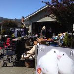 MickaCoo volunteers hosting a garage sale benefit