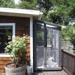 Cleverly designed aviary fits on deck next to house