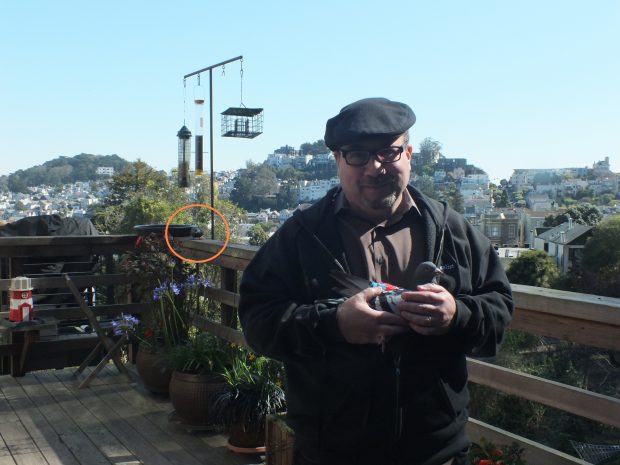 Craig on his deck with Amelio and a hungry visitor